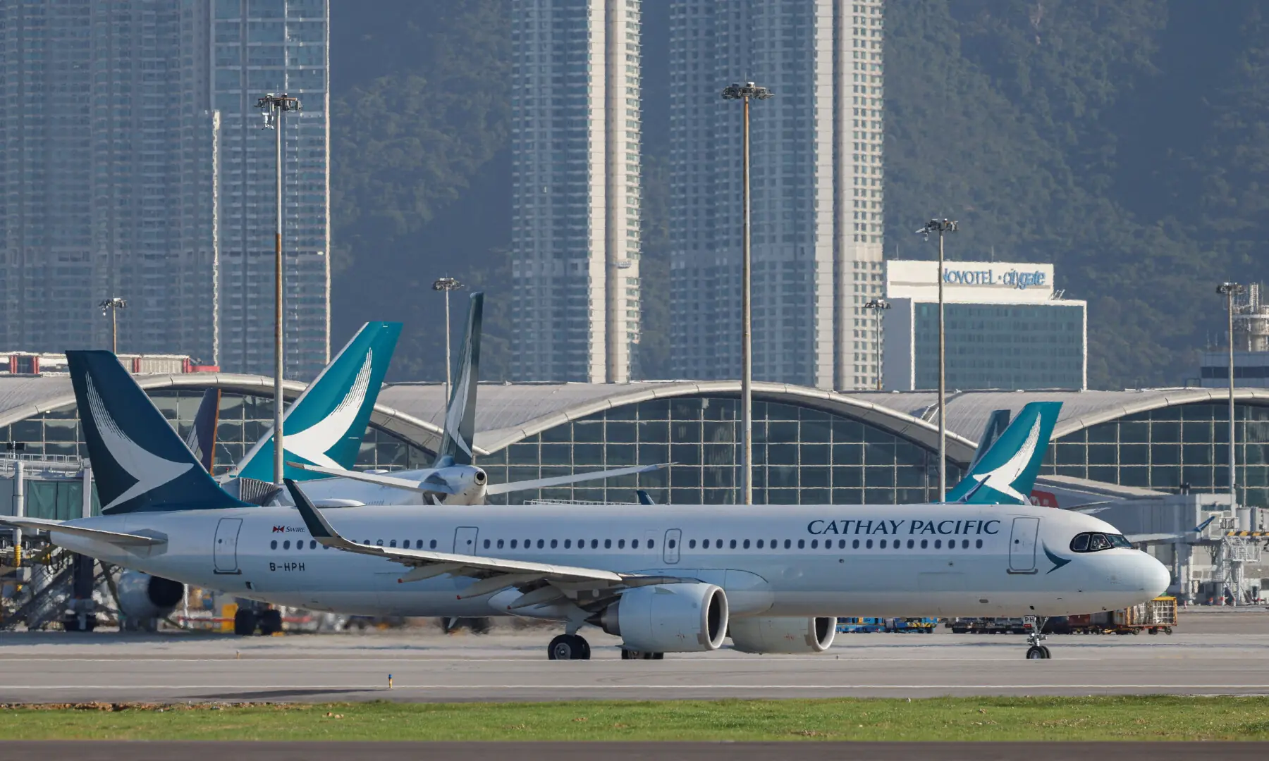 A Cathay Pacific aircraft taxis at Hong Kong International Airport on the day of the official launch of its third runway, in Hong Kong, China on Nov 28, 2024. &mdash; Reuters/File