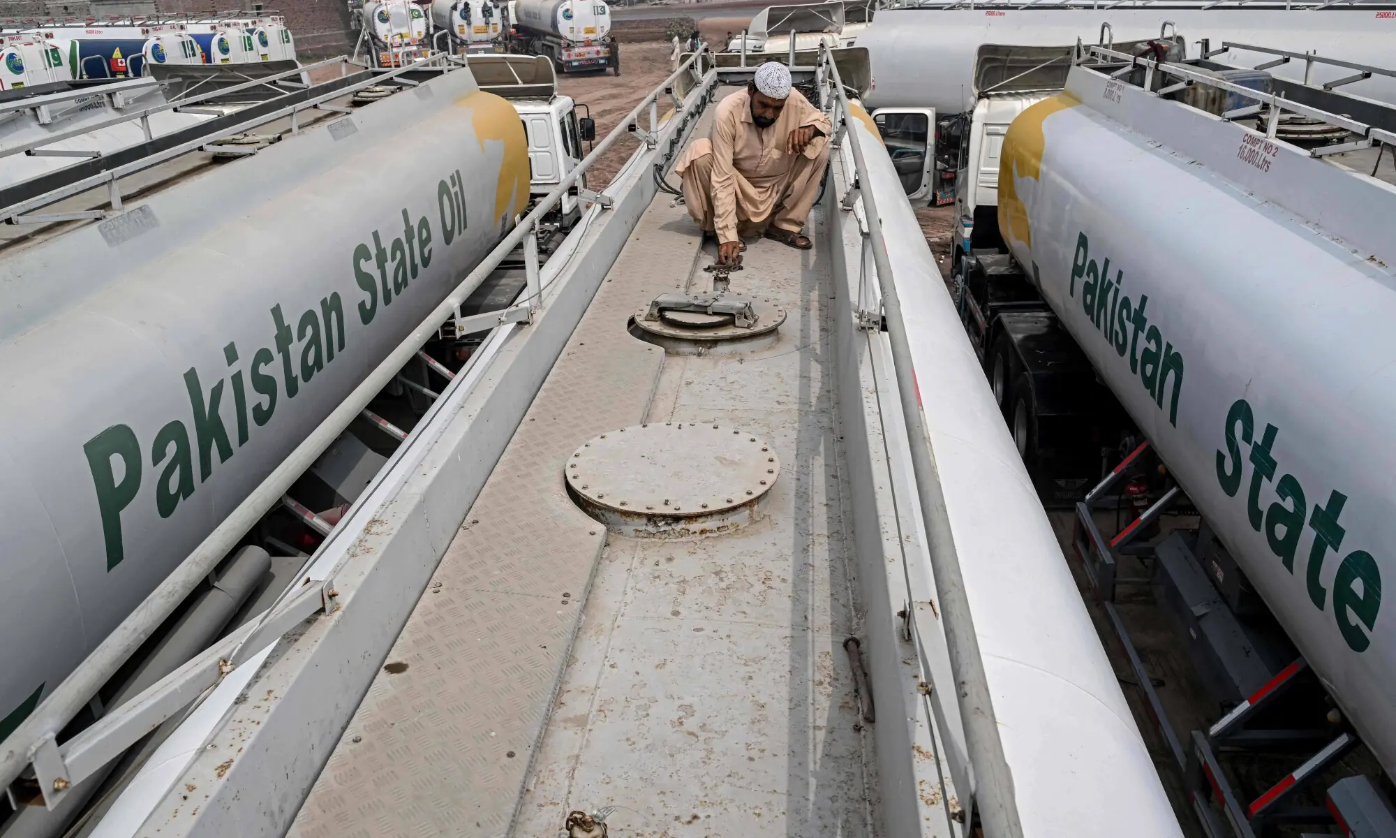 A worker seals the Pakistan State Oil tanker&rsquo;s lid at the fuel storage facility in Sheikhupura district in Lahore on March 10, 2026. &mdash; AFP