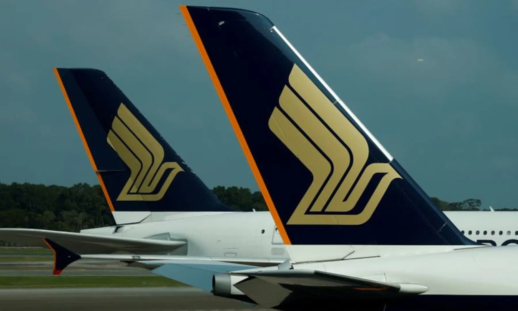 Singapore Airlines planes sit on the tarmac at Singapore&rsquo;s Changi Airport on March 11, 2020. &mdash; Reuters/File