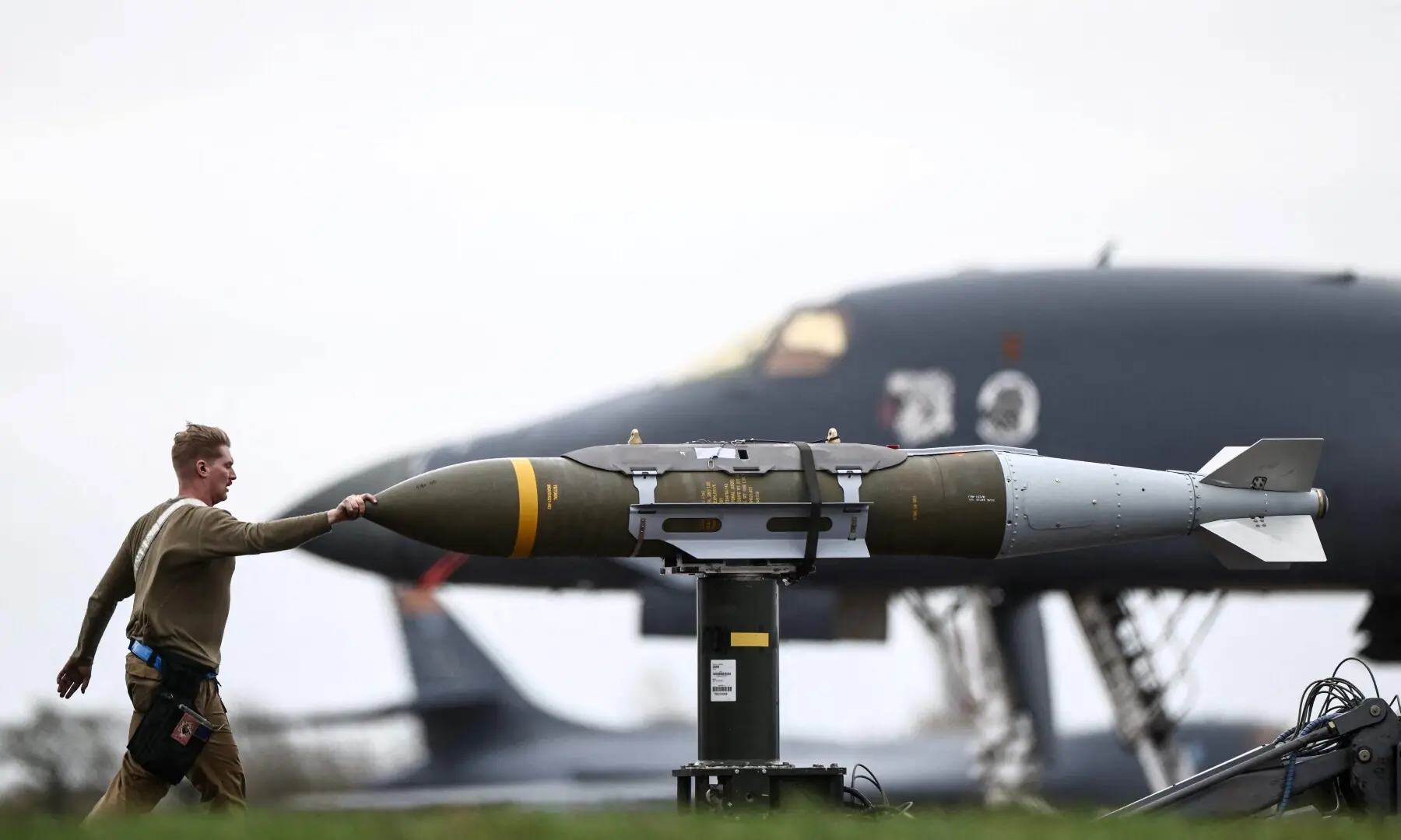 US Air Force ground personnel prepare Joint Direct Attack Munitions (JDAM) for a US Air Force B-1 Lancer bomber on the tarmac at RAF Fairford in south-west England on March 12. &mdash; AFP