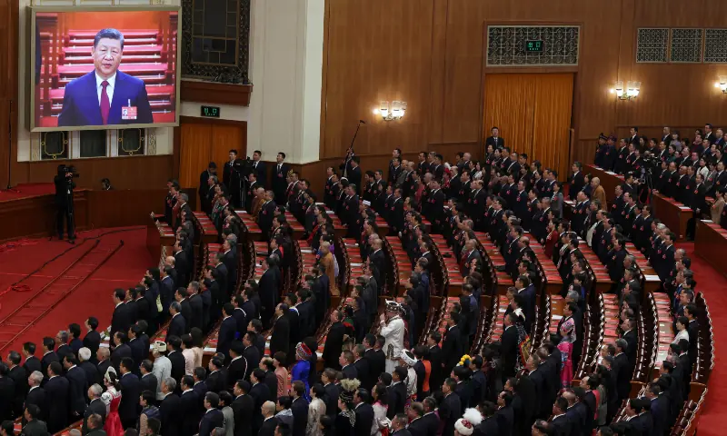 A screen shows Chinese President Xi Jinping as delegates sing the national anthem at the closing session of the National People&rsquo;s Congress (NPC) at the Great Hall of the People in Beijing, China on March 12, 2026. &mdash; Reuters