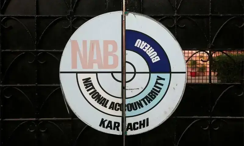 A logo of the National Accountability Bureau (NAB) is seen on the main entrance of their office in Karachi, Pakistan. &mdash; Reuters/File