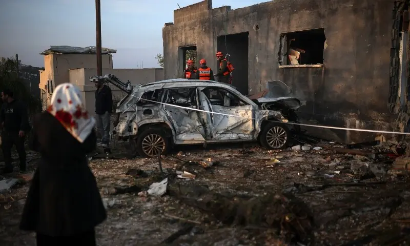Israeli emergency responders work at the site of an impact by an Iranian missile, amid the US-Israel conflict with Iran, in northern Israel, March 13, 2026. &mdash;Reuters