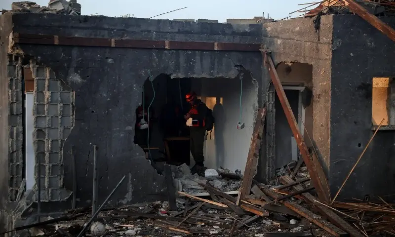 Israeli emergency responders work at the site of an impact by an Iranian missile, amid the US-Israel conflict with Iran, in northern Israel, March 13, 2026. &mdash;Reuters