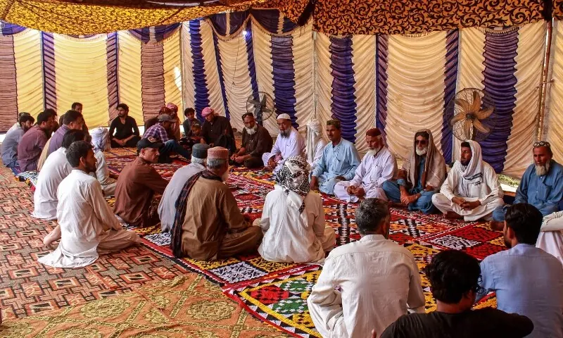 Mourners gather to offer condolences after the death of Pakistani national Muzaffar Ali, who was killed in Dubai amid the ongoing Middle East war, after his funeral in Jamshoro in Sindh province on March 12. &mdash; AFP