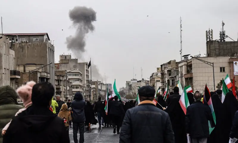 Black smoke rises following an airstrike, as Iranians take part in the Al-Quds Day rally, a commemoration in support of the Palestinian people on the last Friday of the Islamic holy month of Ramadan, in Tehran on March 13, 2026. &mdash; AFP