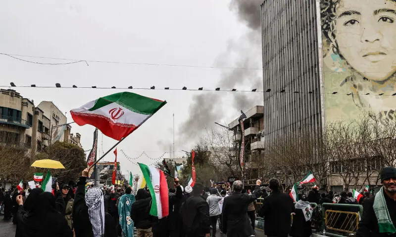 Black smoke rises following an airstrike, as Iranians take part in the Al-Quds Day rally, a commemoration in support of the Palestinian people on the last Friday of the Islamic holy month of Ramadan, in Tehran on March 13, 2026. &mdash; AFP