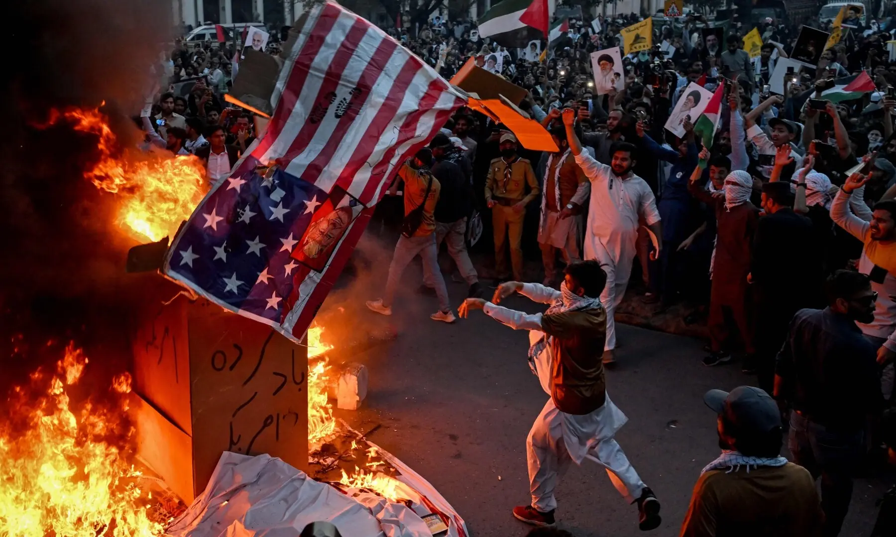 Demonstrators burn the US flag during a rally to mark Al-Quds Day in Lahore on March 13. &mdash; AFP