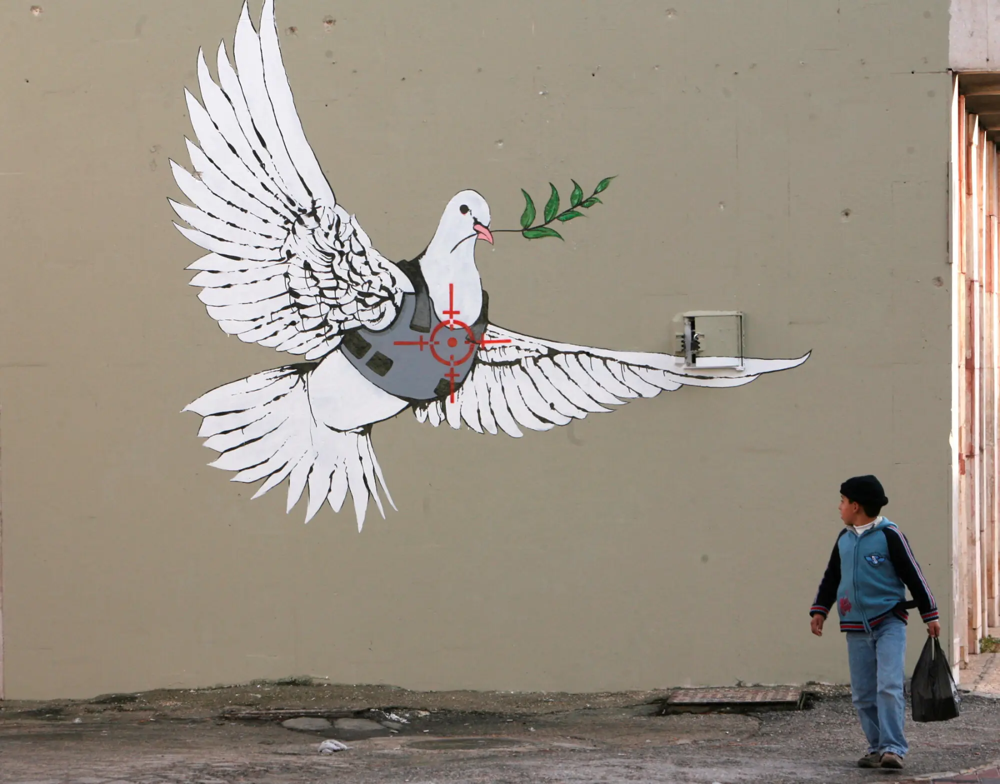 A Banksy painting in Bethlehem, Palestine. Photo: Reuters