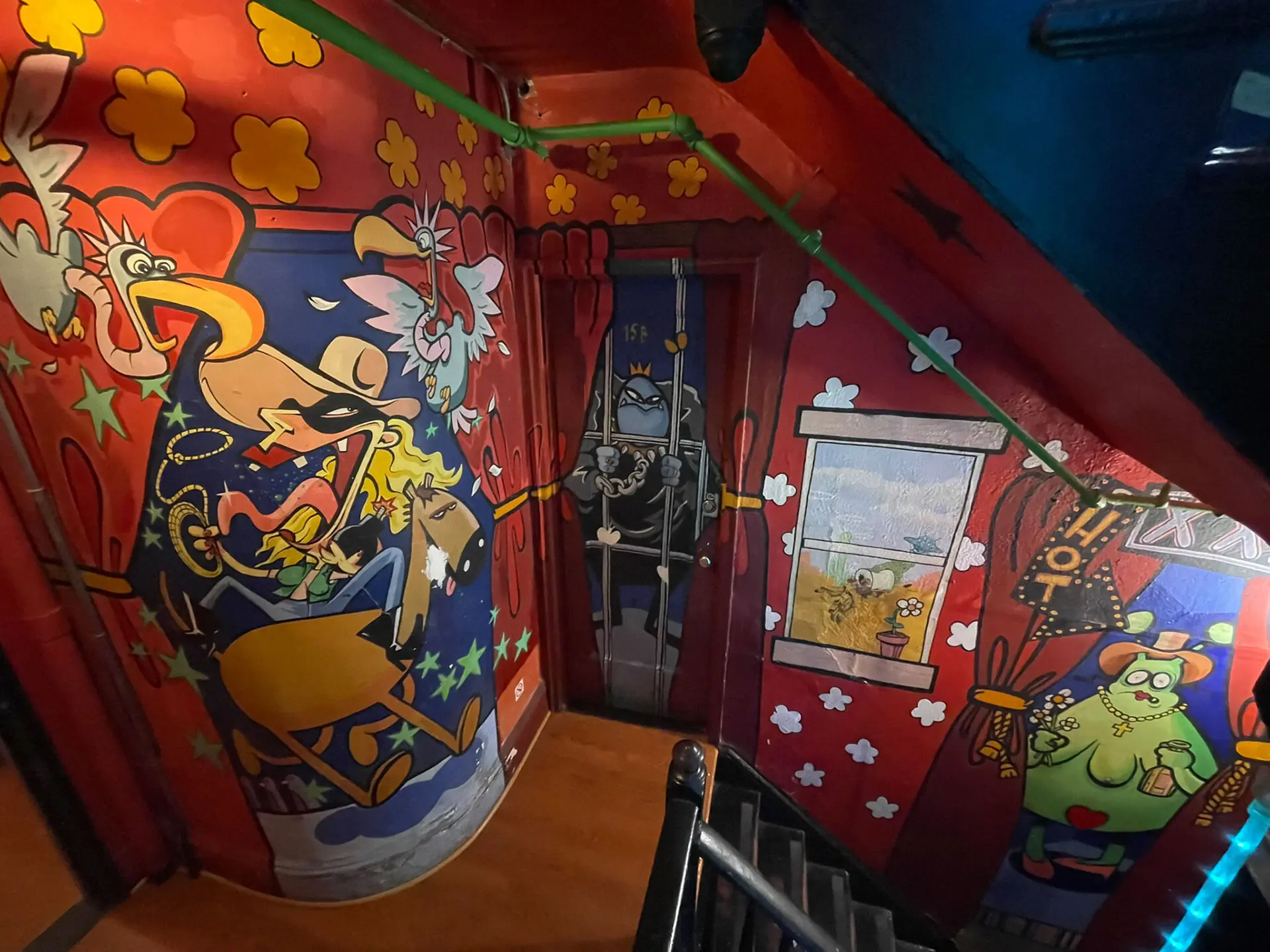 A stairwell at the Carlton Arms Hotel painted by Banksy. Photo: Reuters