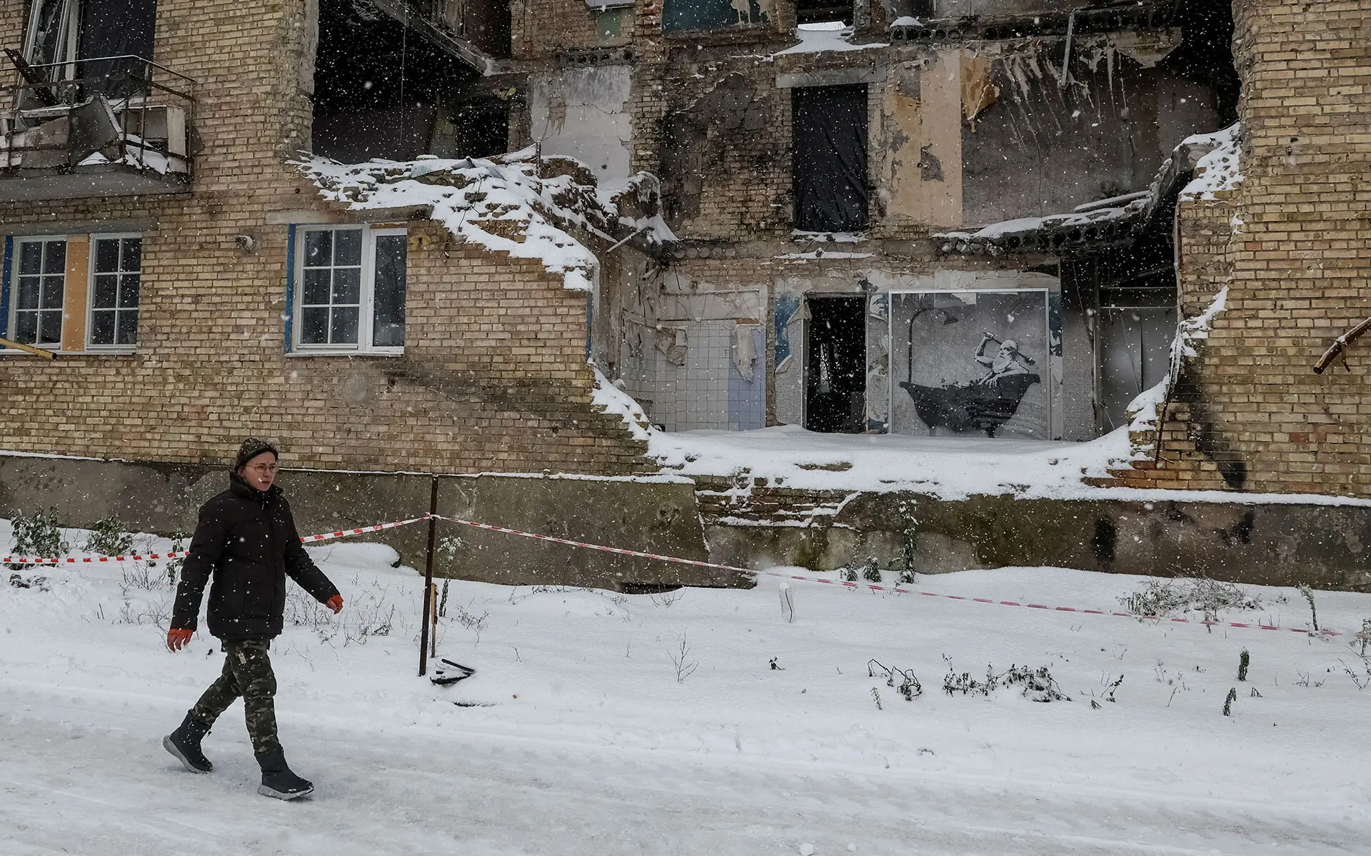 Horenka resident Tetiana Reznychenko reacted differently seeing Del Naja&rsquo;s picture when shown shots of the three potential Banksys but denied knowing any of the men. Photo: Reuters