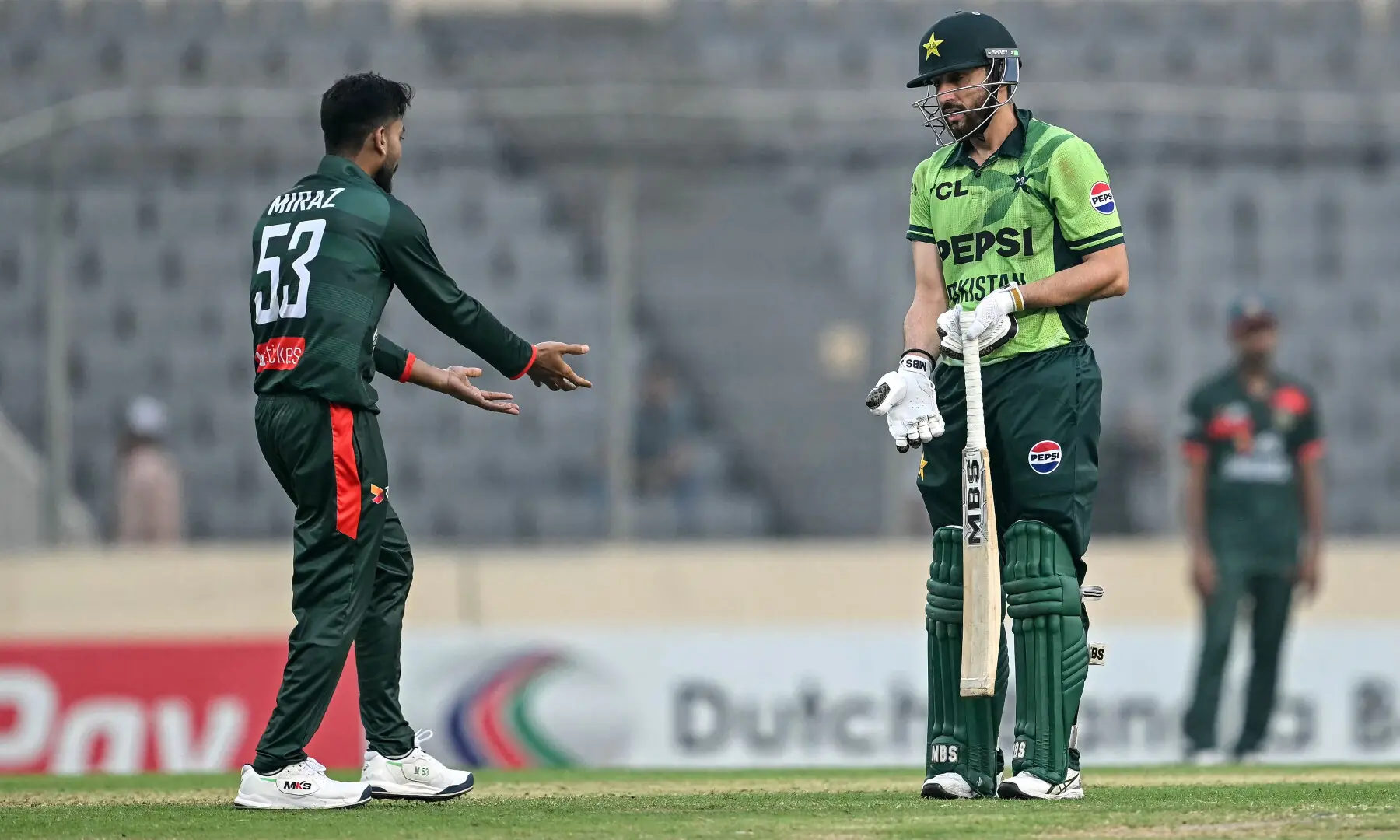 Salman Agha (R) speaks with Bangladesh&rsquo;s captain Mehidy Hasan Miraz after his dismissal during the second one-day international (ODI) cricket match between Bangladesh and Pakistan at Sher-e-Bangla National Stadium in Mirpur on March 13, 2026. &mdash; AFP