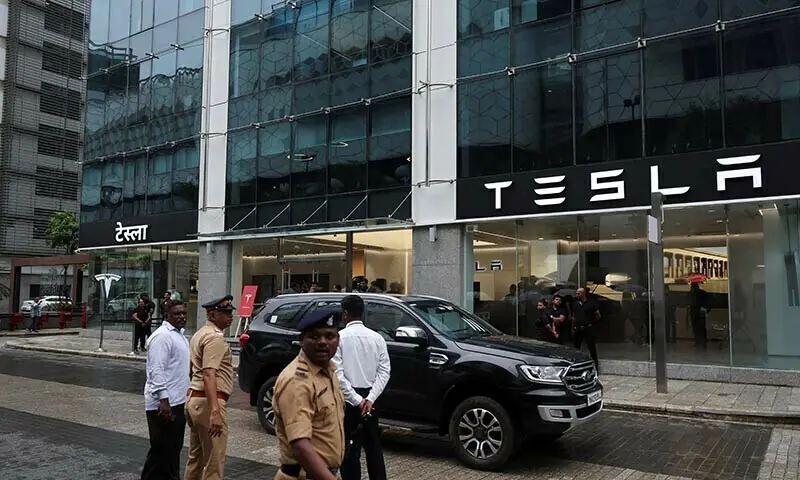 Police officers direct traffic outside the Tesla showroom ahead of its opening in Mumbai, India on July 15, 2025. &mdash; Reuters