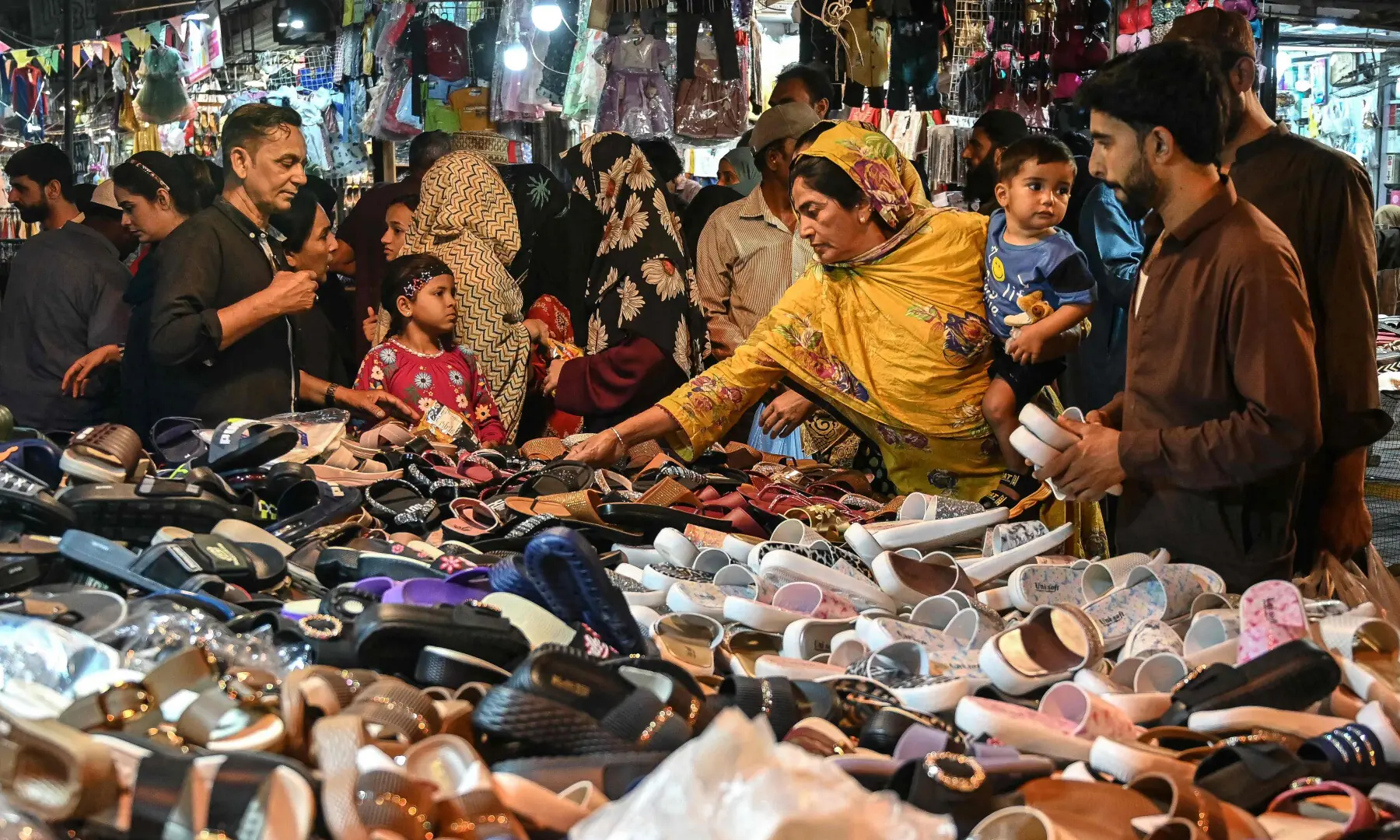People shop for Eid al-Fitr celebrations in Karachi on March 15, 2026. &mdash; AFP