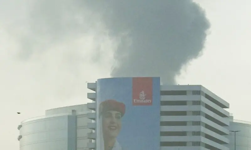 Smoke rising from the Dubai International Airport is seen through the windshield of a vehicle, after a drone attack hit a fuel tank, according to Dubai authorities, amid the US-Israel conflict with Iran, in Dubai, United Arab Emirates, March 16, 2026. &mdash;Reuters
