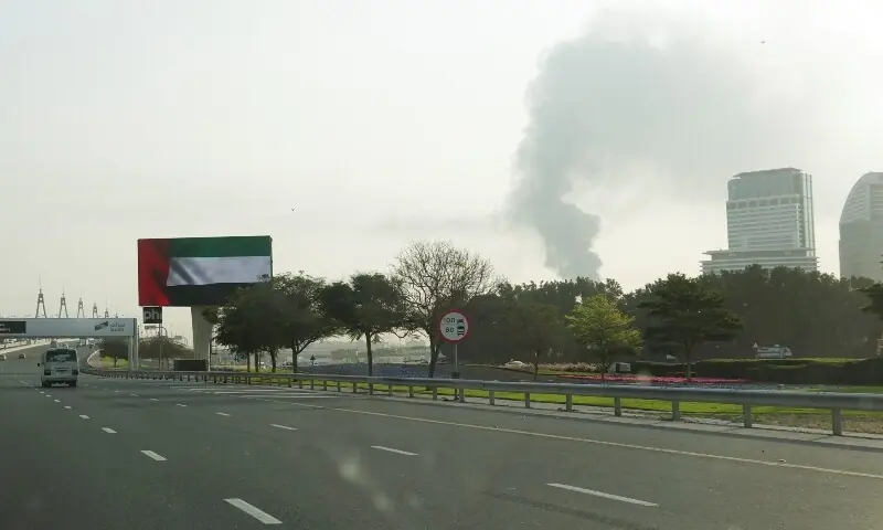 Smoke rising from the Dubai International Airport is seen through the windshield of a vehicle, after a drone attack hit a fuel tank, according to Dubai authorities, amid the US-Israel conflict with Iran, in Dubai, United Arab Emirates, March 16, 2026. &mdash;Reuters
