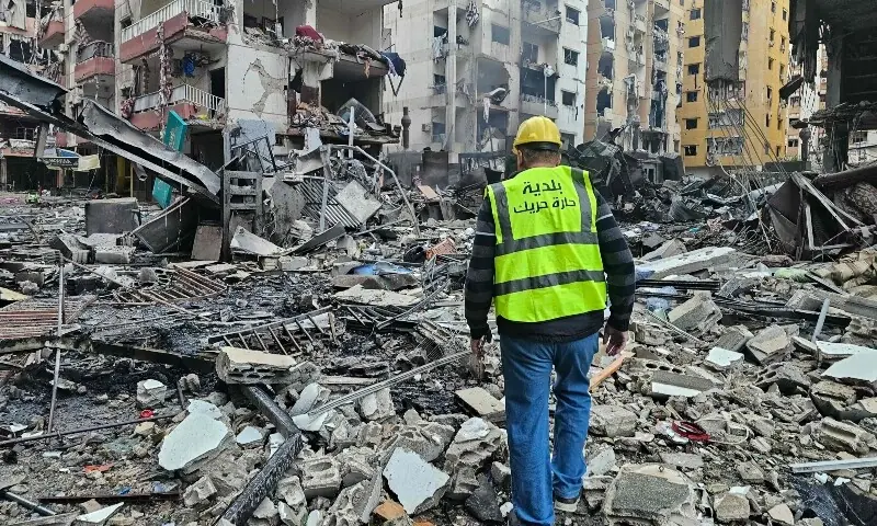 A man inspects a site of overnight Israeli airstrikes in the southern suburbs of Beirut on March 16, 2026. &mdash;AFP
