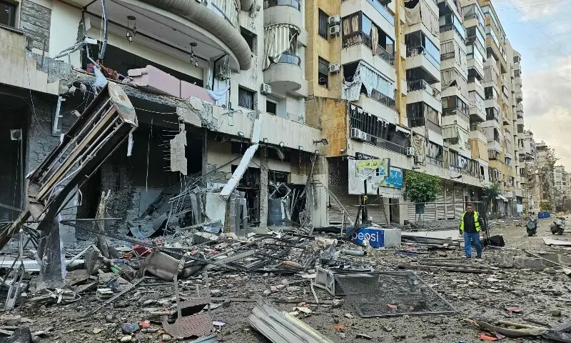 A man inspects a site of overnight Israeli airstrikes in the southern suburbs of Beirut on March 16, 2026. &mdash;AFP