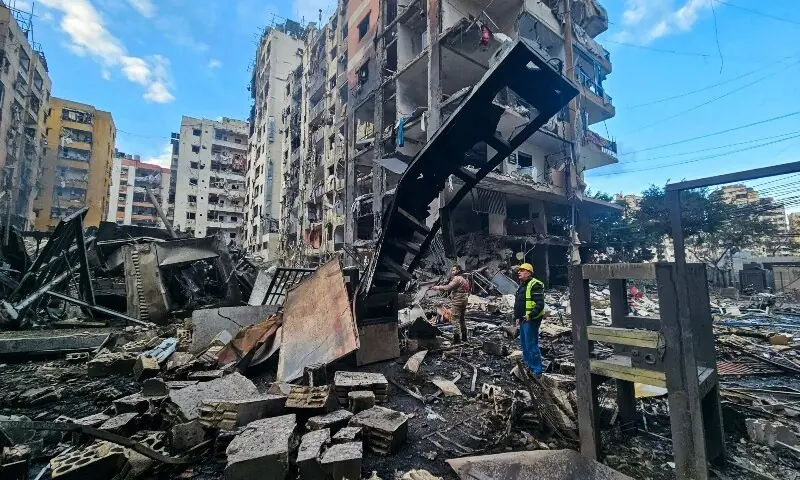 A man inspects a site of overnight Israeli airstrikes in the southern suburbs of Beirut on March 16, 2026. &mdash;AFP