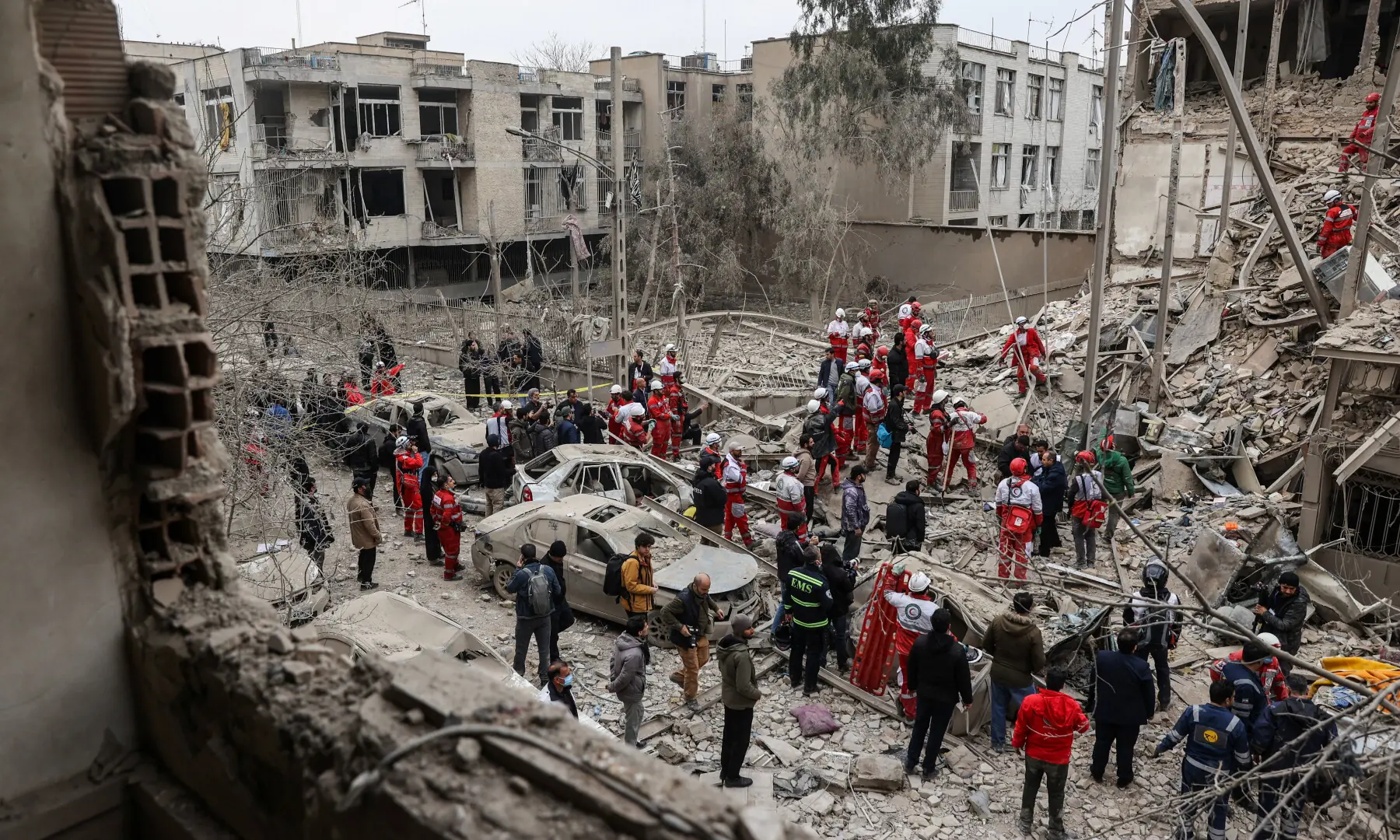 Emergency personnel work at the site of a strike on a residential building, in Tehran, Iran, on March 16, 2026. — WANA via Reuters
