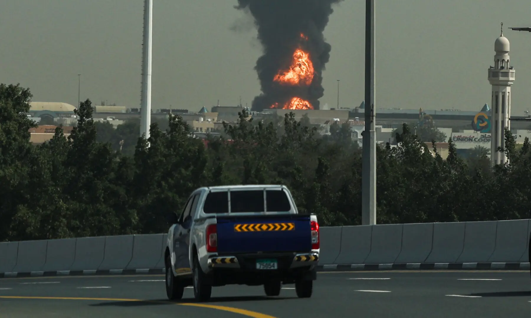 A smoke plume rise from an ongoing fire near Dubai International Airport in Dubai on March 16, 2026. &mdash; AFP