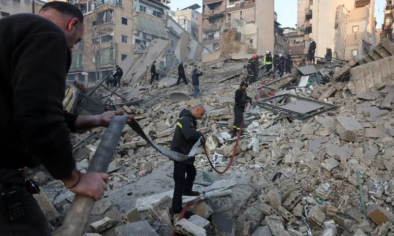 An Emergency worker walks at the site of a collapsed building, in the aftermath of an Israeli strike, following an escalation between Hezbollah and Israel amid the US-Israeli conflict with Iran, in central Beirut&rsquo;s Bachoura neighbourhood, Lebanon, March 18, 2026. &mdash;Reuters