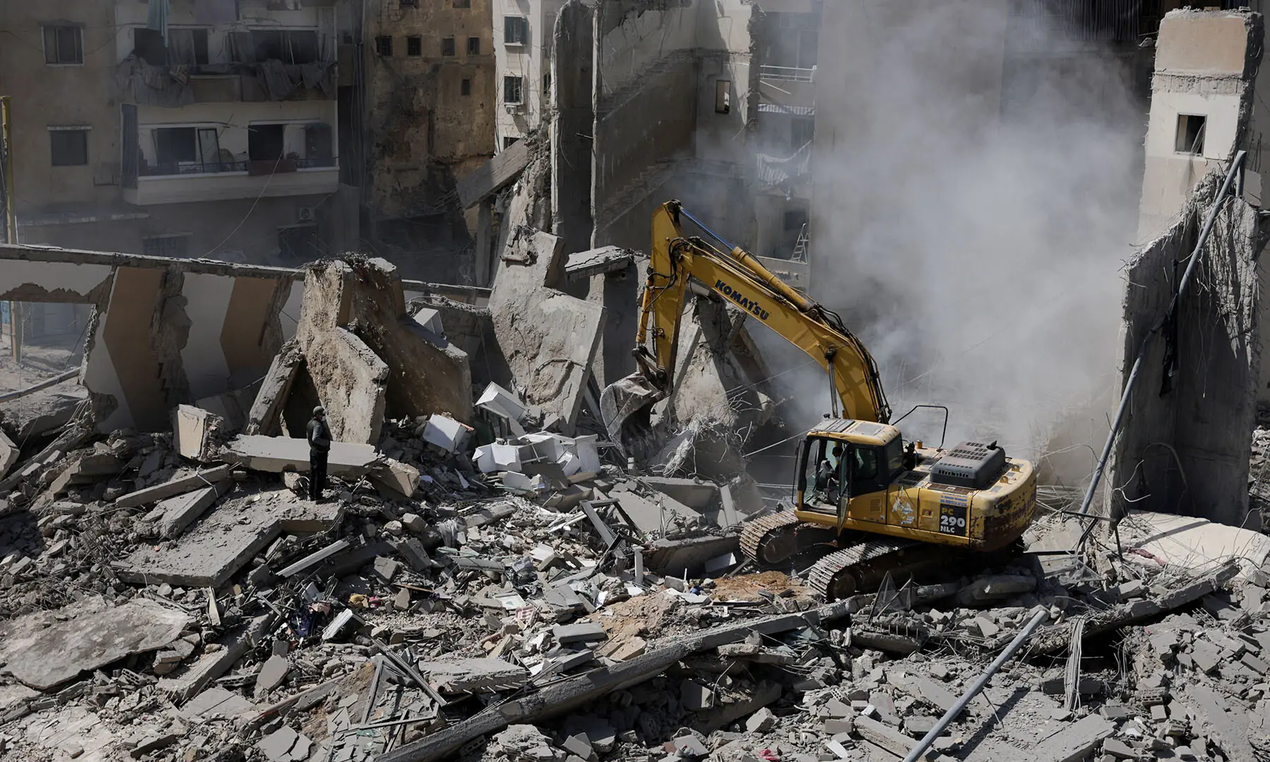 A man uses an excavator to clean debris at the site of an Israeli strike, following an escalation between Hezbollah and Israel in the, Zuqaq al-Blat district in central Beirut, Lebanon, March 18. &mdash; Reuters