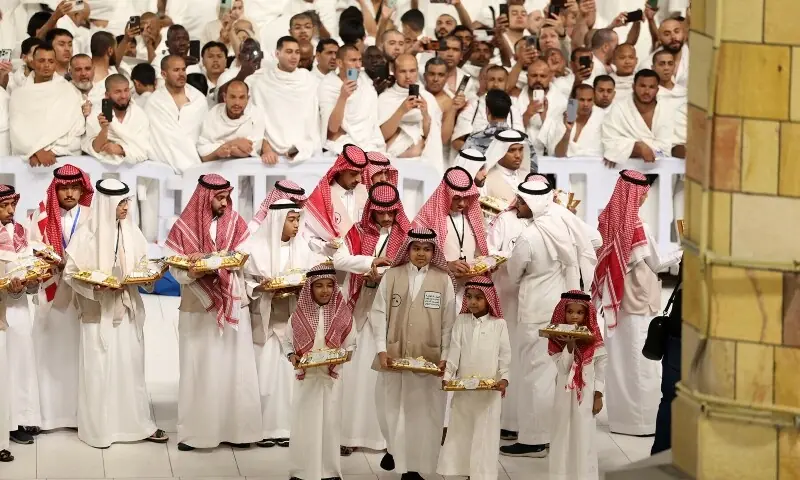 Volunteers prepare to distribute sweets as Muslims gather to perform the morning prayer at the Grand Mosque in Saudi Arabia&rsquo;s holy city of Mecca at the start of Eidul Fitr early on March 30, 2025 &mdash; AFP/File