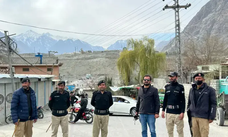 Policemen stand guard on a road in Gilgit on March 4, 2026. &mdash; via Jamil Nagri