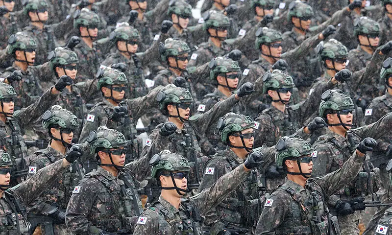A file photo of South Korean troops marching at a military parade in Seoul, South Korea in September 2023. &mdash; Reuters/File