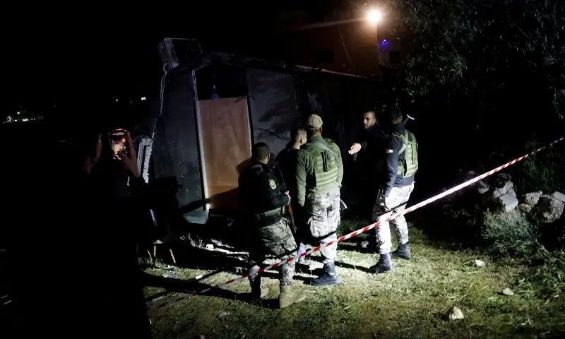 Palestinian security forces gather at the scene where Palestinian women were killed in an Iranian missile attack near Hebron in the Israeli-occupied West Bank March 18. &mdash; Reuters