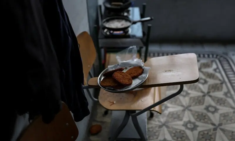 Plated food sits on a chair inside a school that has been turned into a shelter, following an escalation between Hezbollah and Israel amid the US-Israeli conflict with Iran, in Beirut, Lebanon, March 16, 2026. &mdash;Reuters