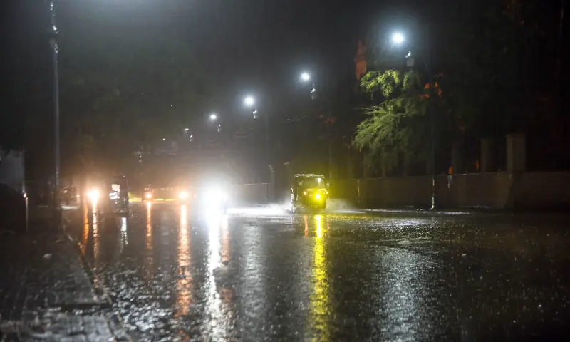 Vehicles travel along a road in Karachi amid heavy rain and wind that killed 20 people and injured eight in rain-related incidents on March 18. &mdash; White Star