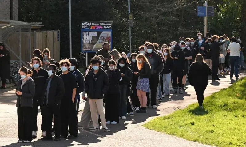 People queue to receive vaccinations at the Sports centre on the University of Kent campus, following an outbreak of meningitis cases in Kent, in Canterbury, Britain on March 18, 2026. &mdash; Reuters