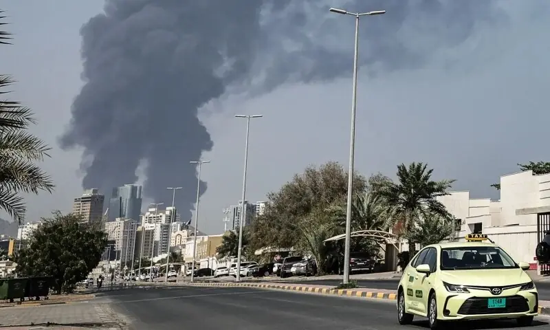Smoke rises from the direction of an energy installation in the Gulf emirate of Fujairah on March 14, 2026. &mdash; AFP