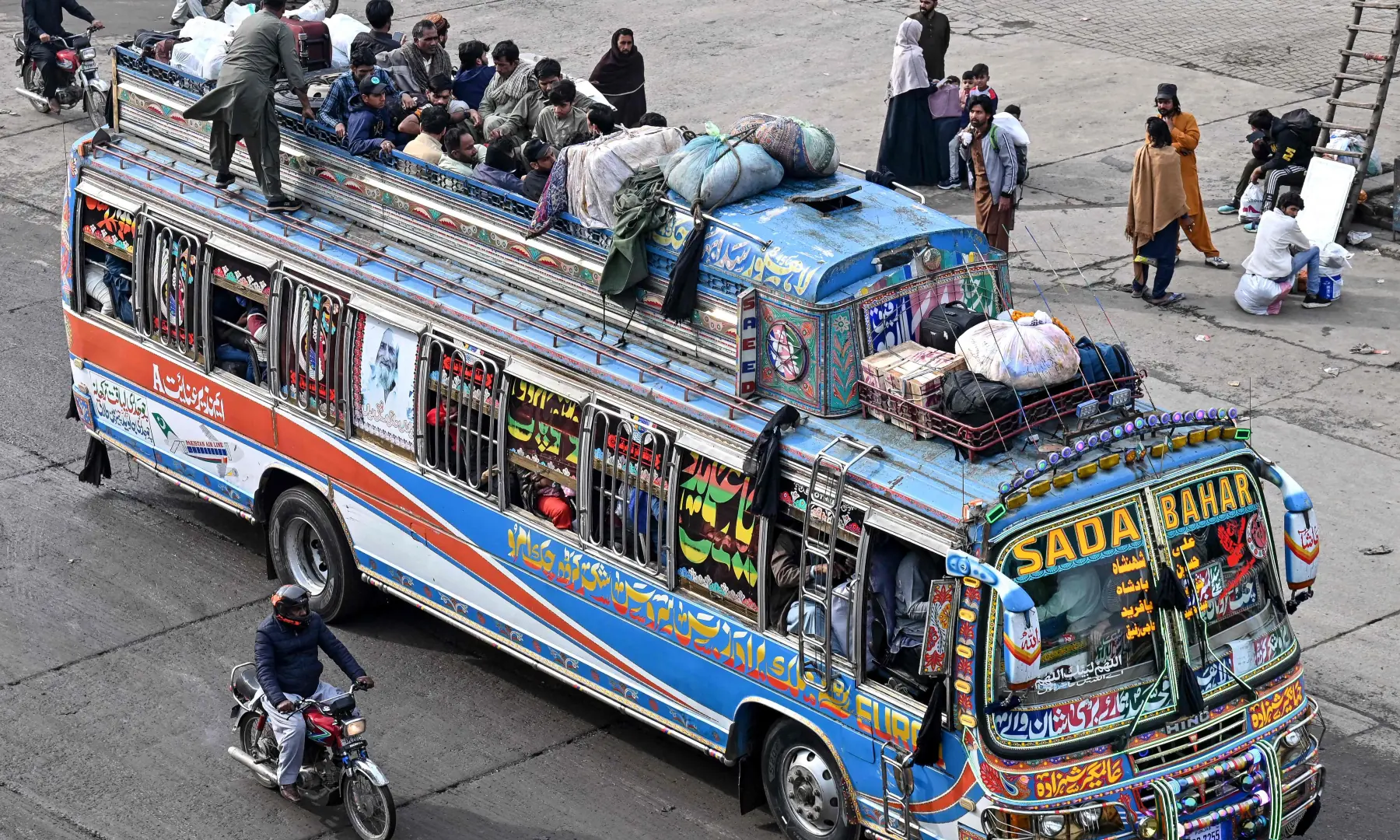 Muslims ride an overcrowded bus while returning to their hometowns ahead of Eidul Fitr, which marks the end of the Islamic holy fasting month of Ramadan, in Lahore on March 19, 2026. &mdash; AFP