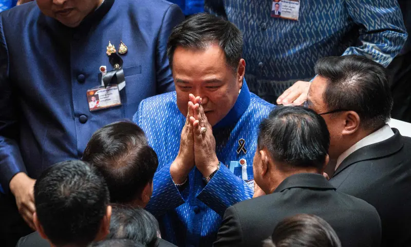 Thailand&rsquo;s caretaker Prime Minister and Bhumjaithai Party leader Anutin Charnvirakul (C) greets fellow party members after a vote at Parliament in Bangkok on March 19, 2026. &mdash; AFP