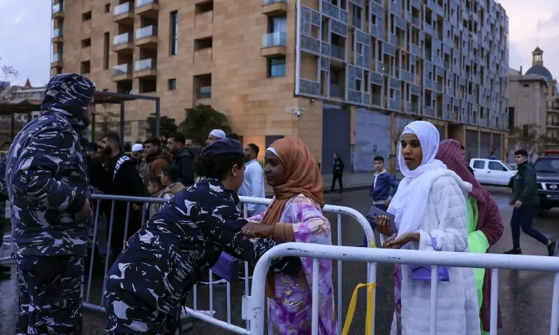 A security personnel frisks a worshipper as she arrives to attend Eidul Fitr prayers, at the Mohammad Al Amin Mosque, following an escalation between Hezbollah and Israel, amid the US-Israeli conflict with Iran, in Beirut, Lebanon, March 20, 2026. &mdash;Reuters