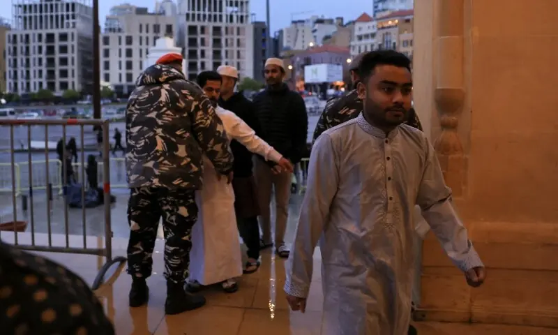 A security personnel frisks a worshipper as she arrives to attend Eidul Fitr prayers at the Mohammad Al Amin Mosque, following an escalation between Hezbollah and Israel, amid the US-Israeli conflict with Iran, in Beirut, Lebanon, March 20, 2026. &mdash;Reuters