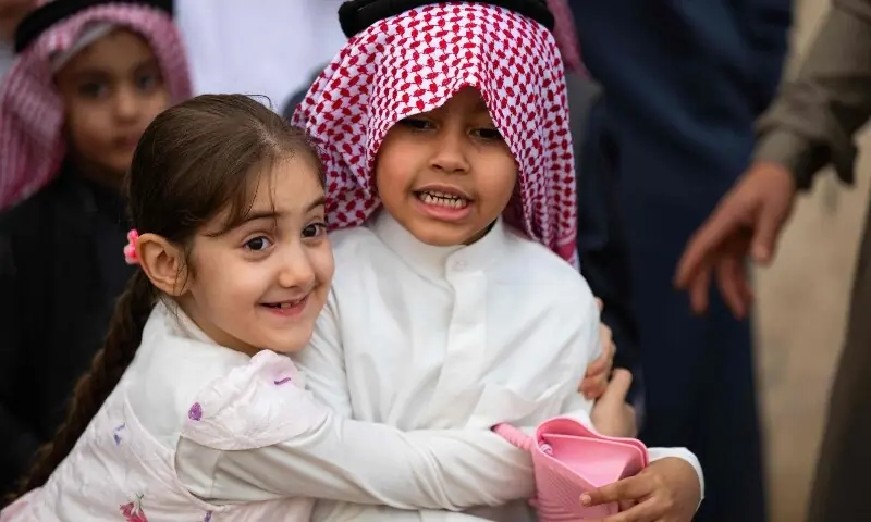 Children celebrate after the Eidul Fitr prayers in the city of Al-Zubair in Basra province, southern Iraq. &mdash; AFP