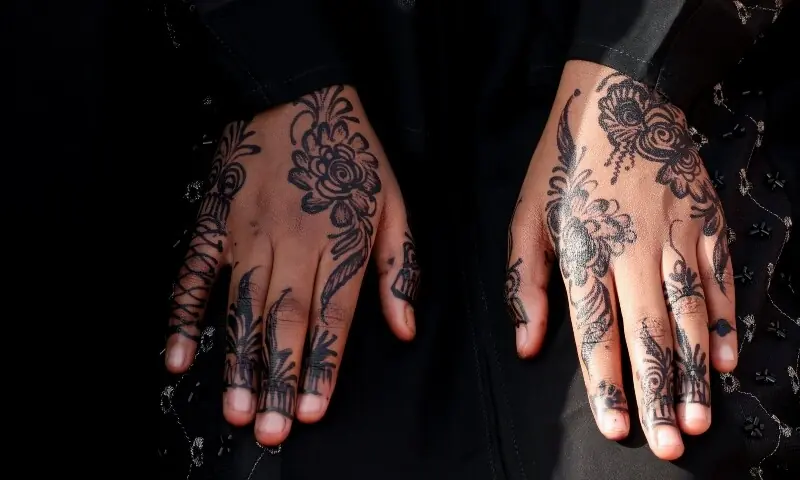 A Muslim woman with henna decorations attends Eidul Fitr prayers at the Sir Ali Muslim Club Ground in Ngara district of Nairobi, Kenya on March 20, 2026. &mdash; Reuters
