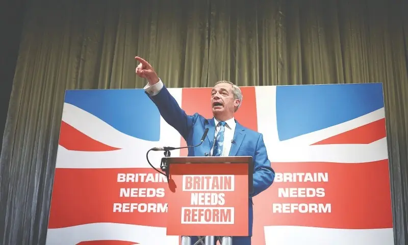 Nigel Farage, a leader of the right-wing populist party Reform UK, answers journalists during a campaign meeting, on June 3, 2024.&mdash;AFP/File