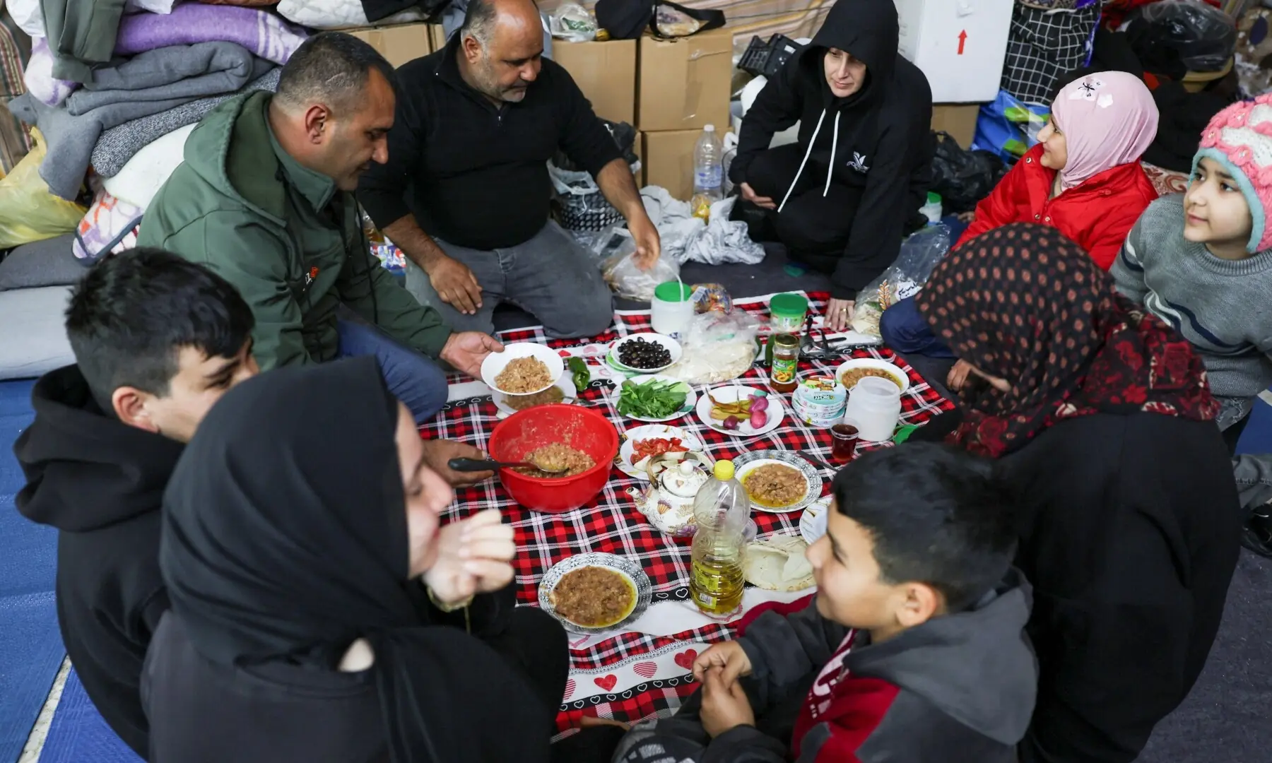 Shia displaced people from South Lebanon eat a meal as they take shelter in a Shia religious centre, on the day of Eidul Fitr, marking the end of Ramasan, following an escalation between Hezbollah and Israel amid the US-Israeli war on Iran, in Sidon, Lebanon, March 20, 2026. &mdash; Reuters