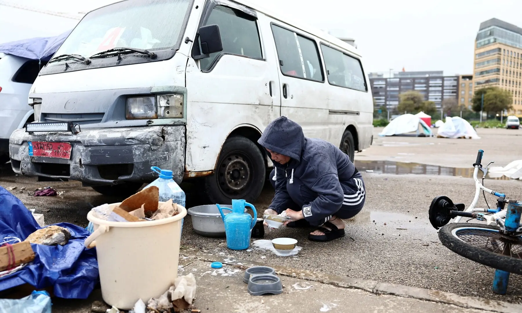 Samah Hjola, 33, displaced from Beirut&rsquo;s southern suburbs, washes items on the day Muslim worshippers attend Eid prayers to mark the end of Ramazan, following an escalation between Hezbollah and Israel amid the US-Israeli war on Iran, in Beirut, Lebanon, March 20, 2026. &mdash; Reuters