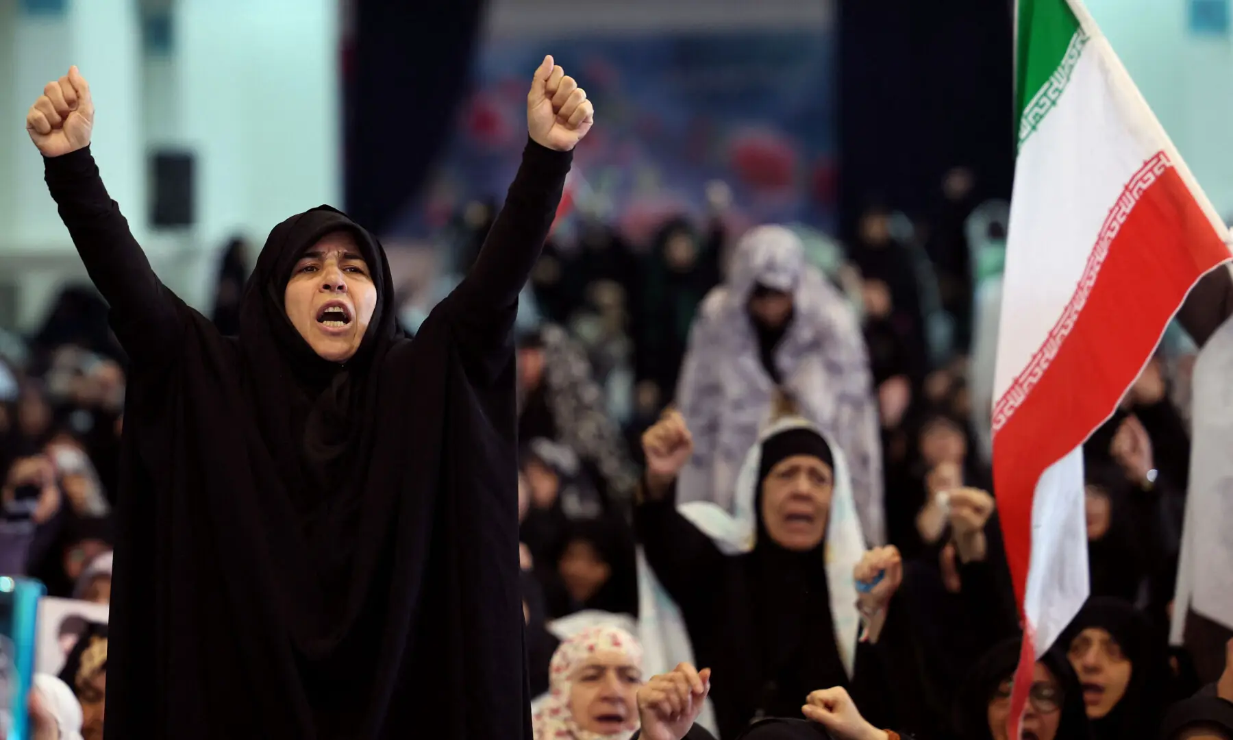 Iranian women shout slogans during Eidul Fitr prayers, at the Grand Mosalla mosque in Tehran on March 21, 2026. &mdash; AFP