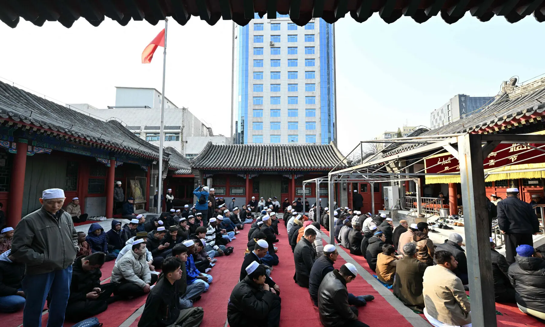 Muslim prepare for the Eidul Fitr prayers, at a mosque in Beijing, China on March 21, 2026. &mdash; AFP