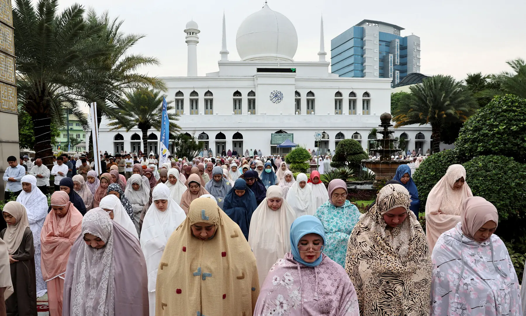 Muslims offer mass prayers during Eidul Fitr, at the compound of Al Azhar Great Mosque in Jakarta, Indonesia on March 21, 2026. &mdash; Reuters