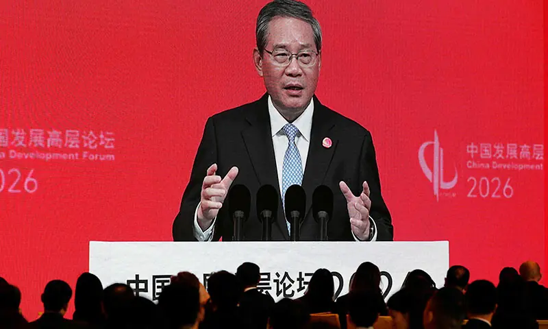 Chinese Premier Li Qiang is seen on a big screen live broadcasting his speech at the opening of the China Development Forum 2026 held at the Diaoyutai State Guesthouse in Beijing, China on March 22. &mdash; AFP
