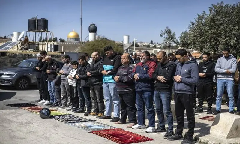 Muslims take part in street prayers in Jerusalem.&mdash;AFP