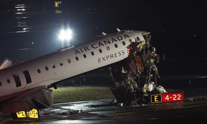An Air Canada Express CRJ-900 sits on the runway after colliding with a Port Authority fire truck at LaGuardia Airport in New York, on March 23, 2026. &mdash; AFP